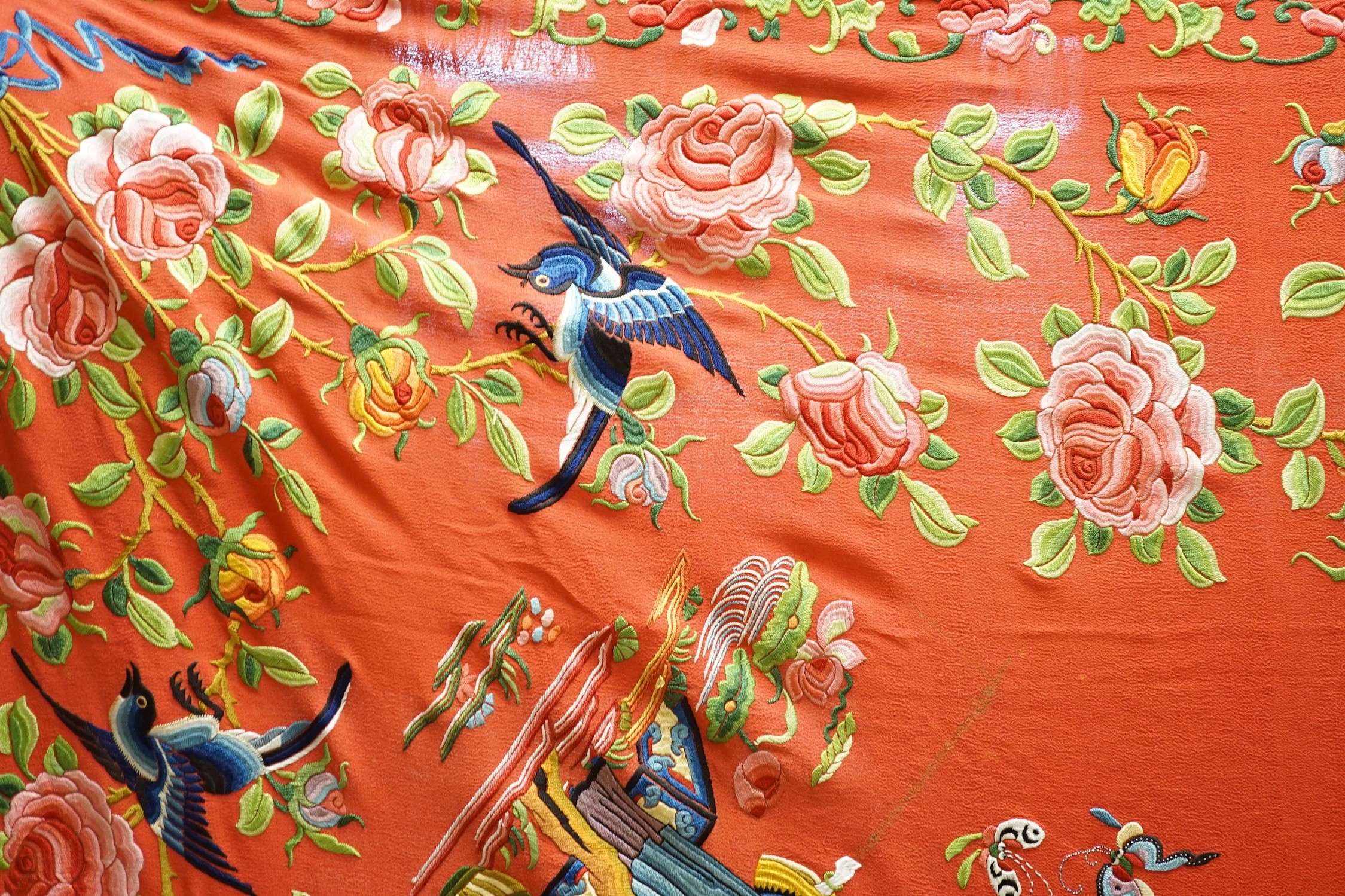 A Chinese early 20th century silk crepe, polychrome embroidered shawl